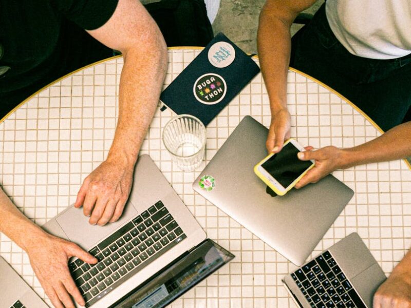 photo of people using laptop